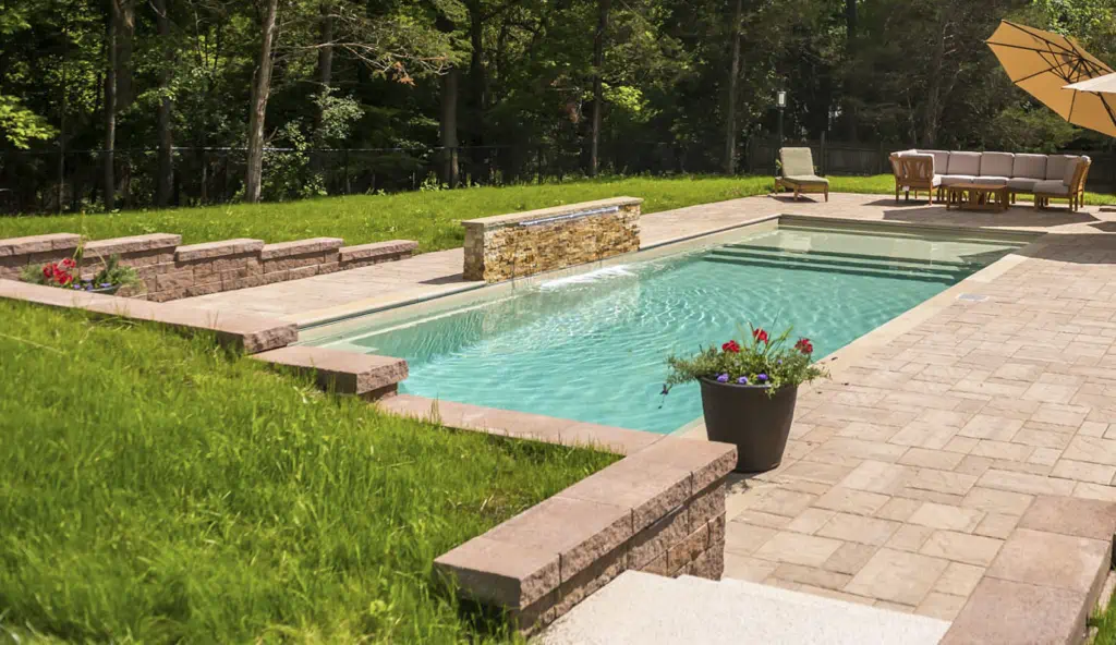 The Pinnacle swimming pool design by Leisure Pools: shown in graphite grey color