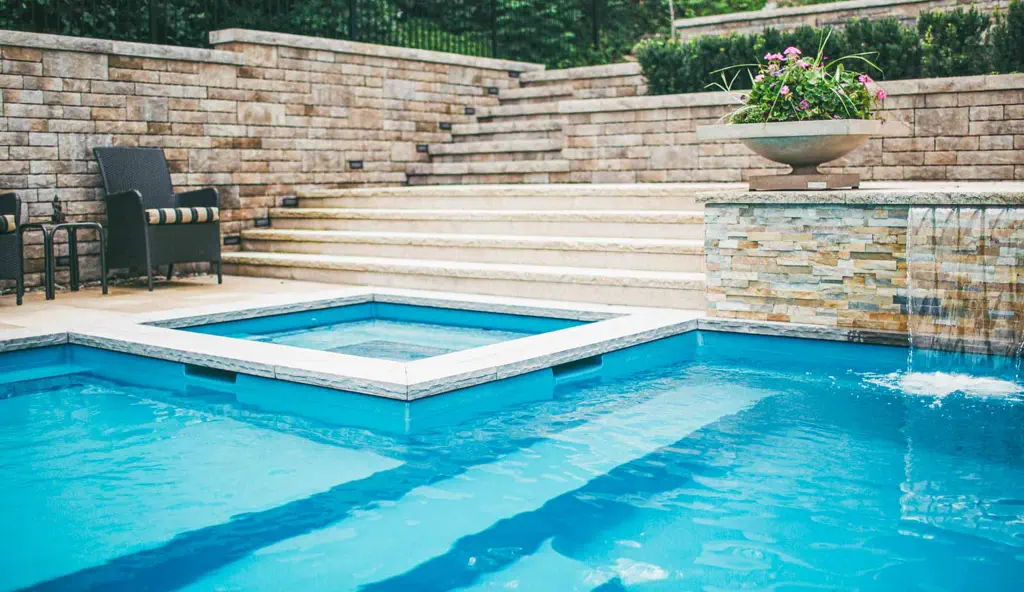 The Ultimate fiberglass swimming pool design in Crystal blue by Leisure Pools.