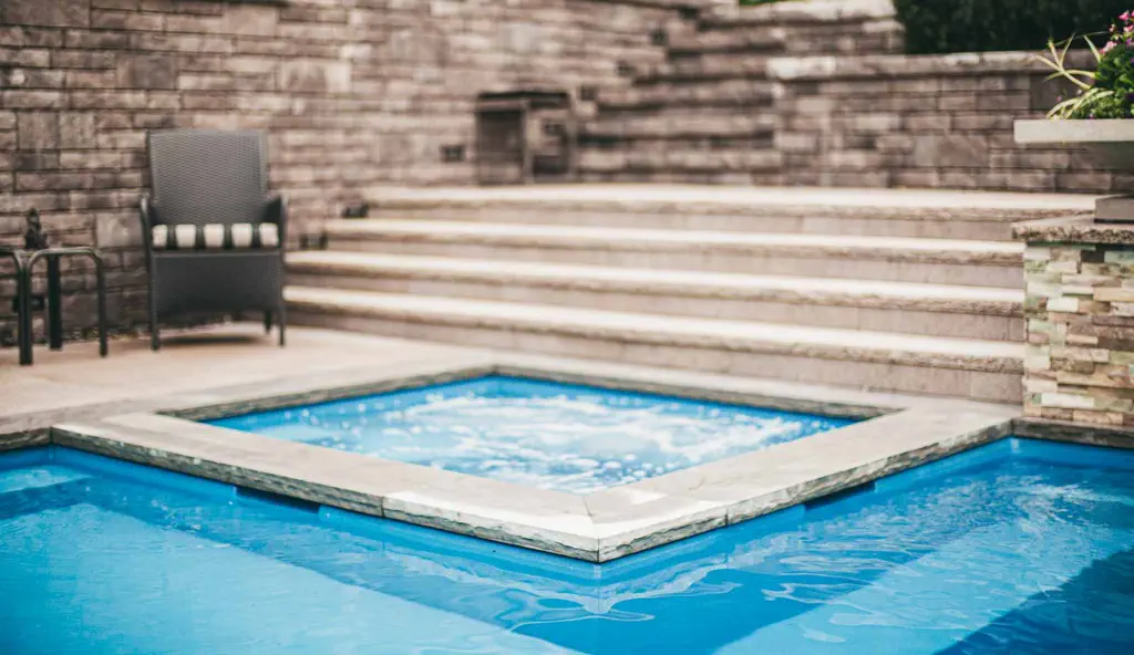 The Ultimate fiberglass swimming pool design in Crystal blue by Leisure Pools.